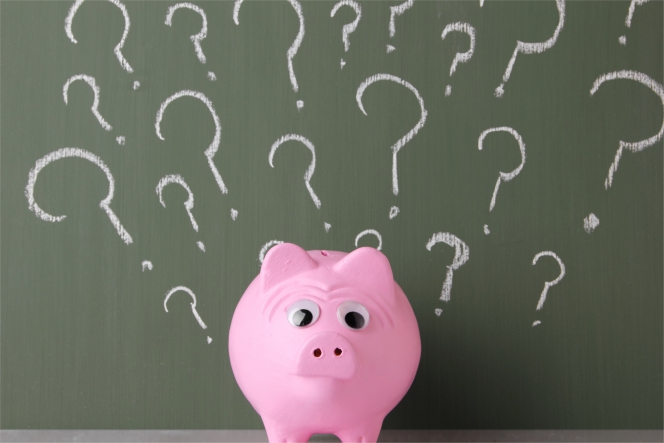 Une tireire cochon avec des points d'interrogation