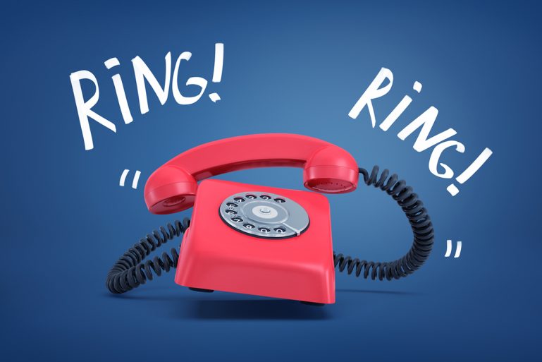 un téléphone fixe rouge avec les mots ring ! ring !